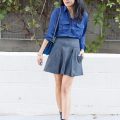 Woman_wearing_blue_blouse_and_wool_mini_skirt
